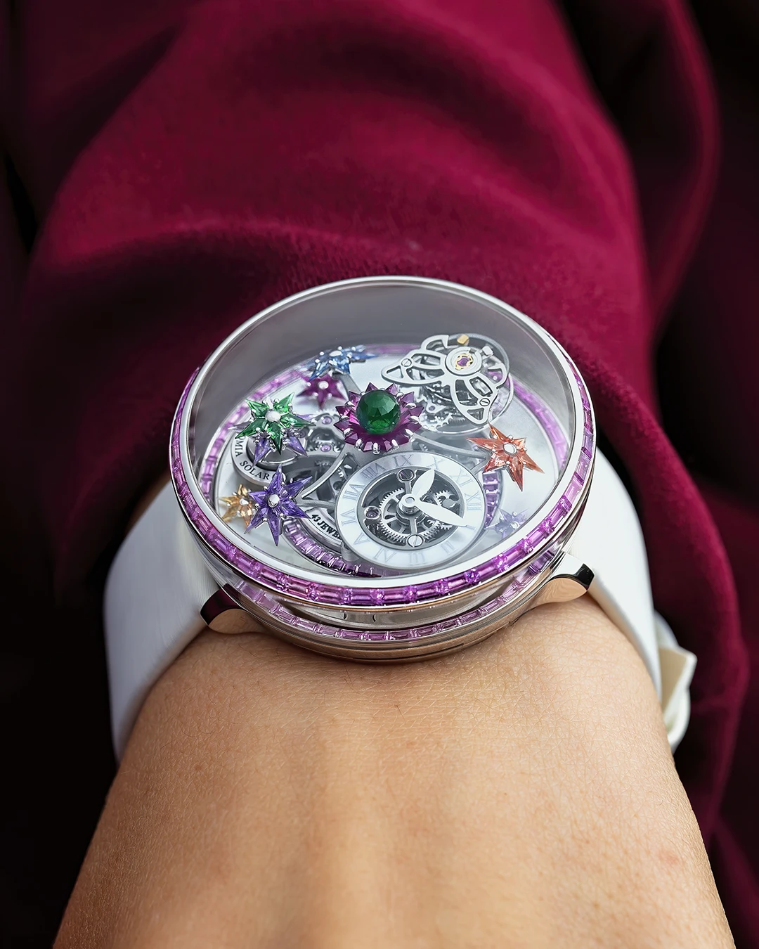 Jacob & Co. Fleurs de Jardin white gold watch with pink sapphires on the wrist